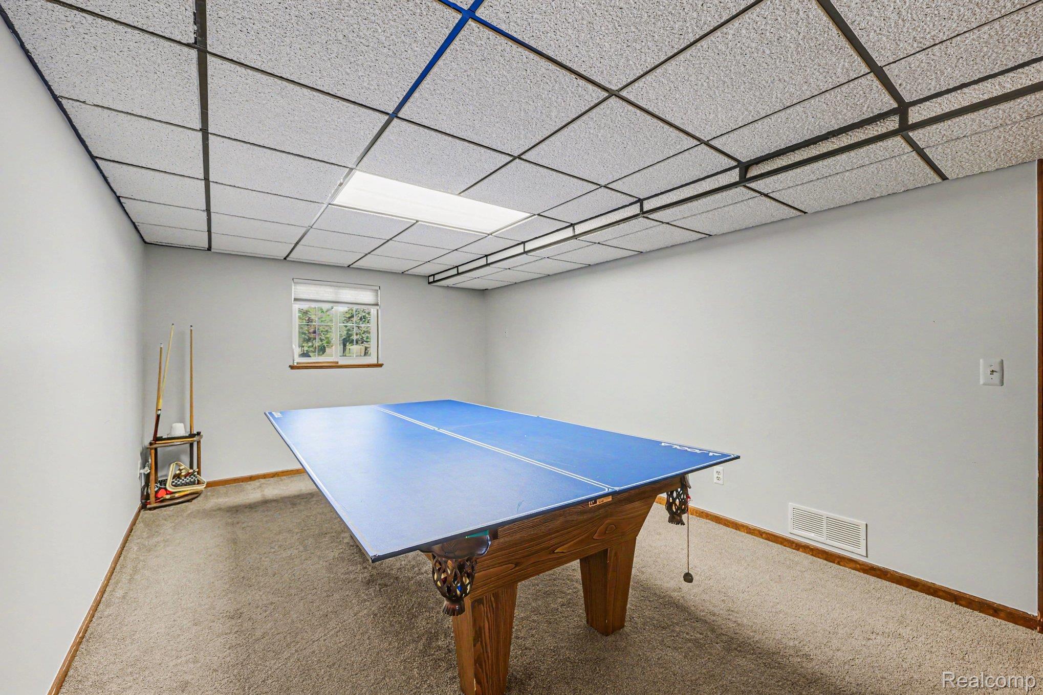 7020 Meldrum Road Fair Haven, MI 48023 - Photo 25 of 43 Spacious room featuring neutral carpeting and a suspended ceiling with integrated lighting