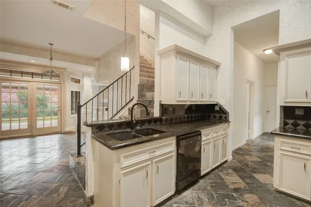 a view of a storage and utility room with a sink