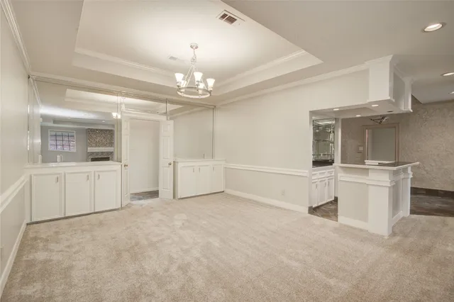 a kitchen with a sink and a stove top oven