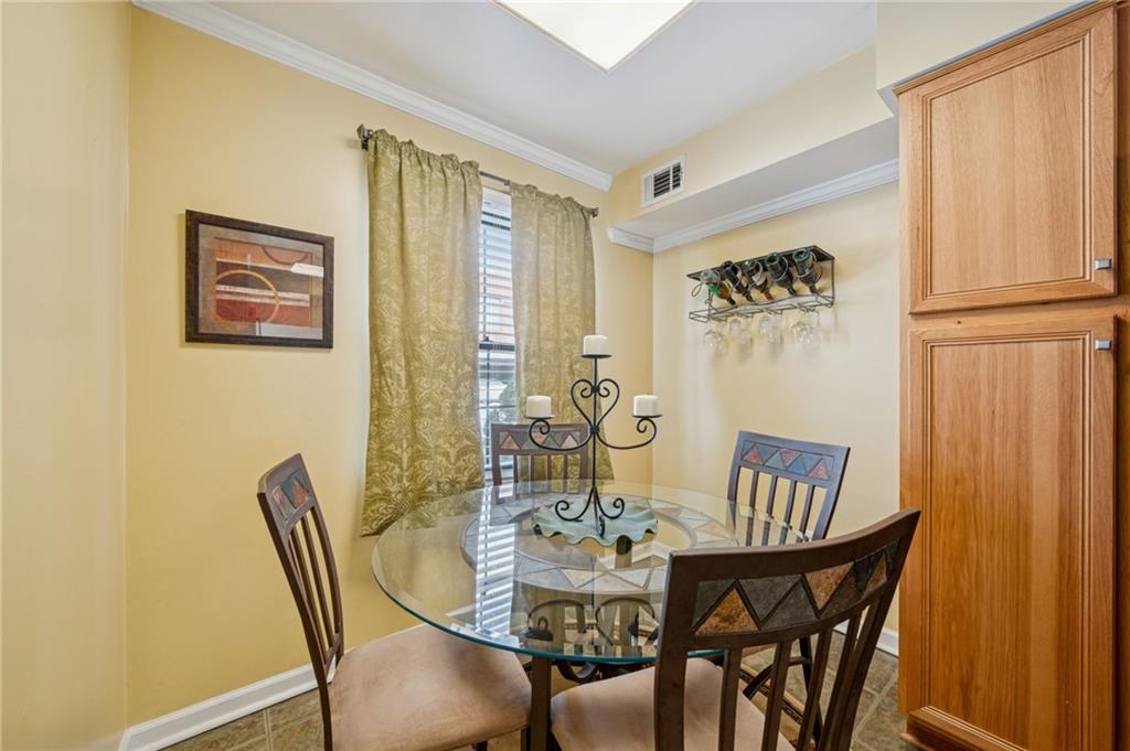 117 Community Court Pittsburgh, PA 15205 - Photo 12 of 34 a view of a dining room with furniture and wooden floor