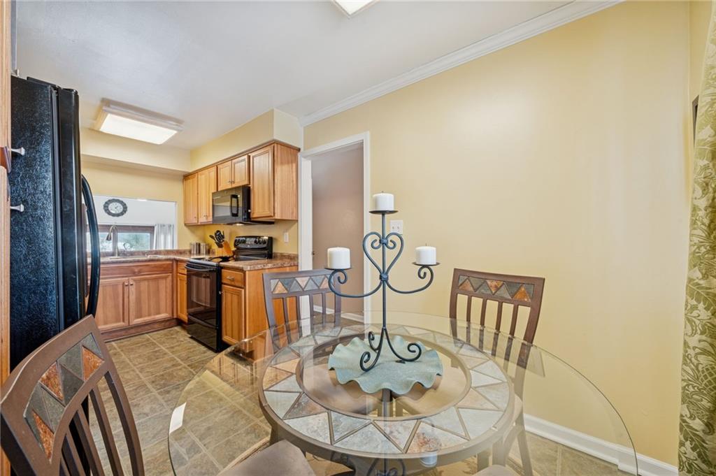 117 Community Court Pittsburgh, PA 15205 - Photo 13 of 34 a kitchen with appliances a sink and cabinets