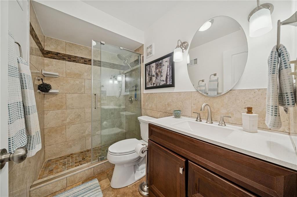 117 Community Court Pittsburgh, PA 15205 - Photo 17 of 34 a bathroom with a sink toilet a mirror and shower