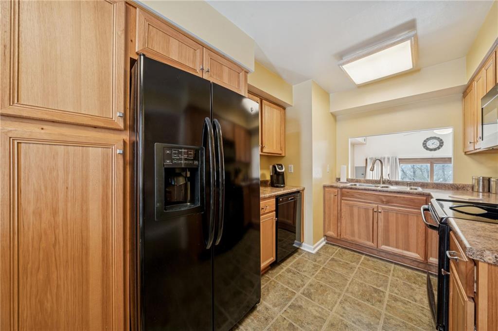117 Community Court Pittsburgh, PA 15205 - Photo 8 of 34 a kitchen with granite countertop stainless steel appliances a refrigerator and cabinets