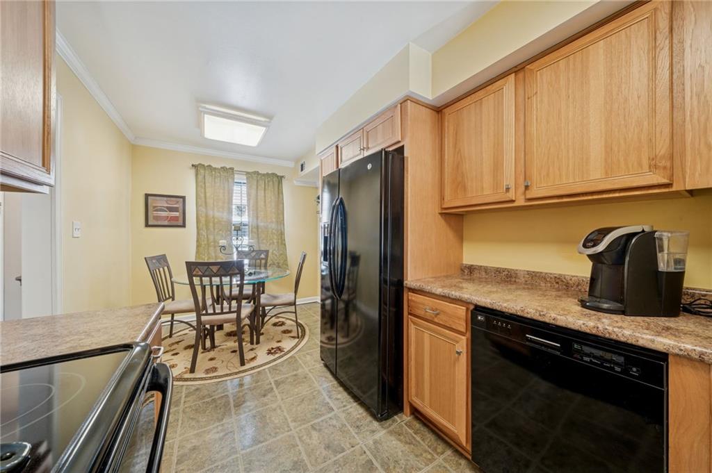 117 Community Court Pittsburgh, PA 15205 - Photo 10 of 34 a kitchen with stainless steel appliances granite countertop sink stove top oven and cabinets