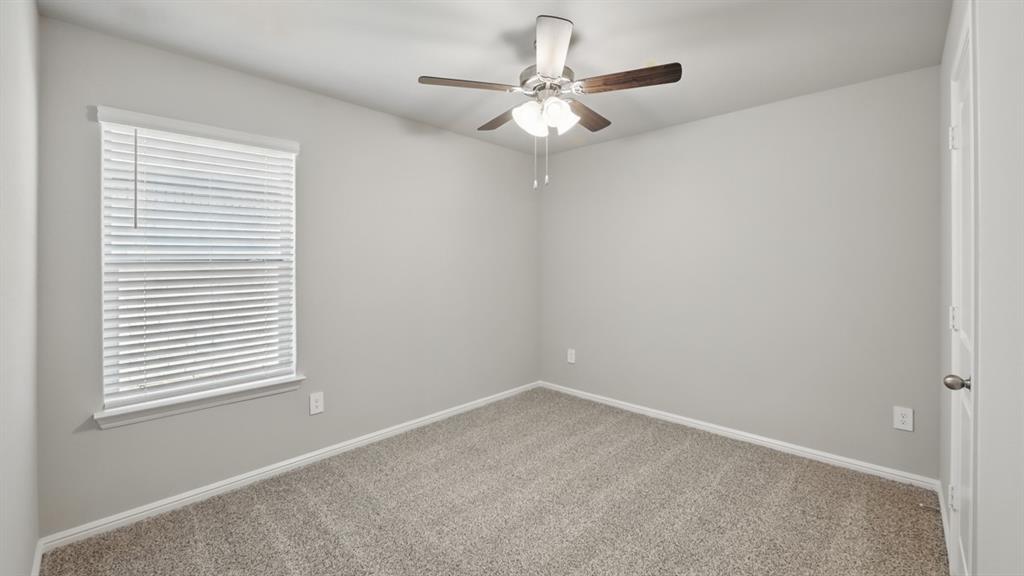 172 Mojave Road Boyd, TX 76023 - Photo 24 of 40 an empty room with a window and a fan