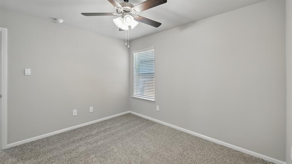 172 Mojave Road Boyd, TX 76023 - Photo 25 of 40 an empty room with a window and chandelier fan