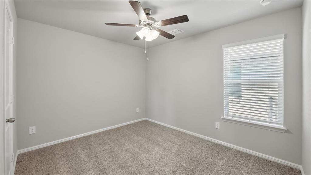 172 Mojave Road Boyd, TX 76023 - Photo 28 of 40 an empty room with a window and a fan