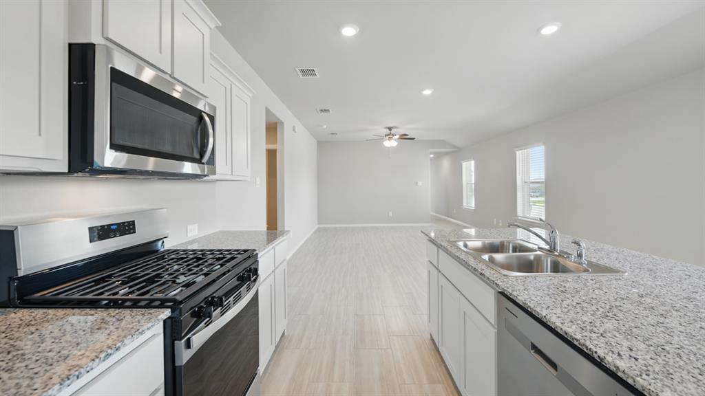 172 Mojave Road Boyd, TX 76023 - Photo 1 of 40 a kitchen with stainless steel appliances granite countertop a sink and a stove