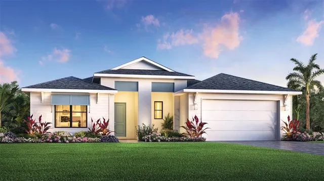 a front view of a house with a garden and yard