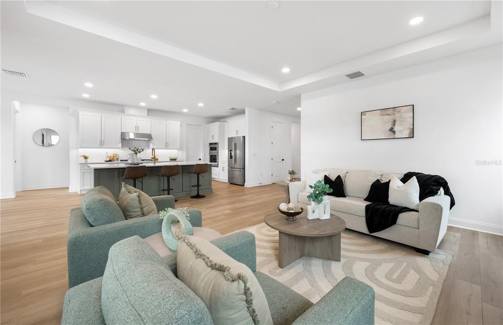 5856 Freestone Circle Apollo Beach, FL 33572 - Photo 13 of 33 a living room with furniture and kitchen view