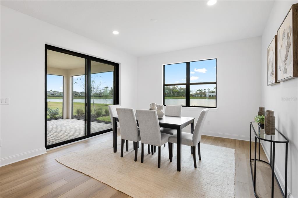 5856 Freestone Circle Apollo Beach, FL 33572 - Photo 15 of 33 a view of a dining room with furniture window and wooden floor