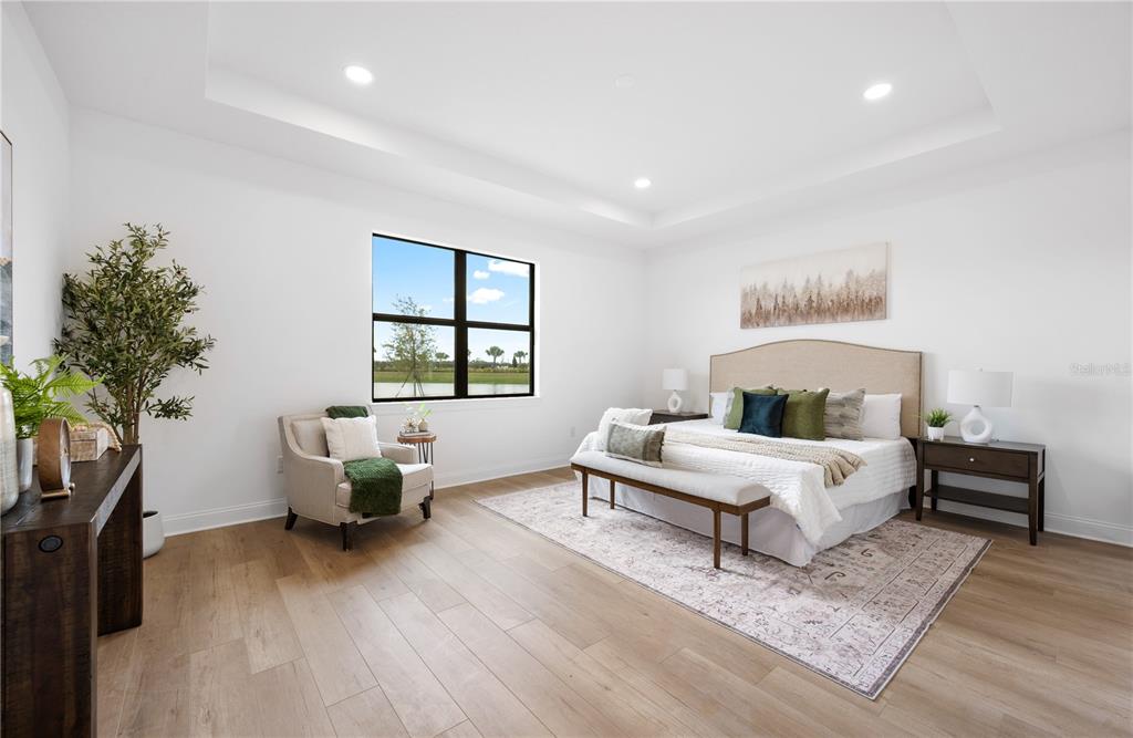 5856 Freestone Circle Apollo Beach, FL 33572 - Photo 16 of 33 a bed room with a bed and a chair