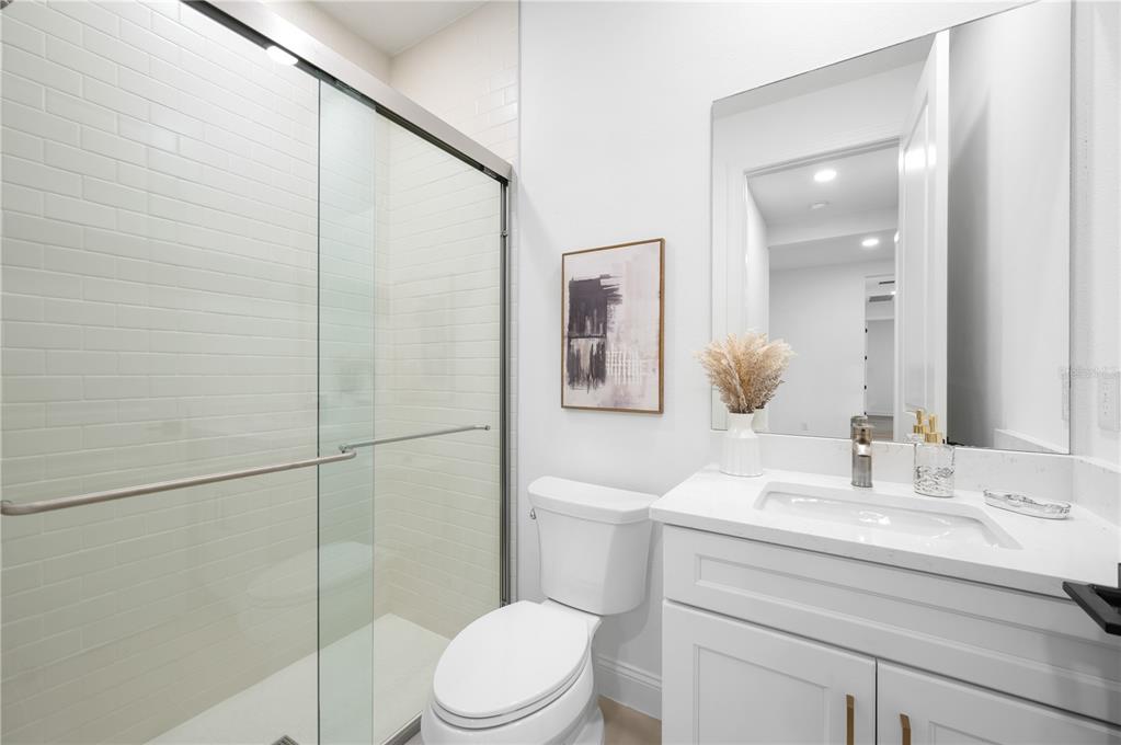 5856 Freestone Circle Apollo Beach, FL 33572 - Photo 24 of 33 a bathroom with a sink a toilet and shower