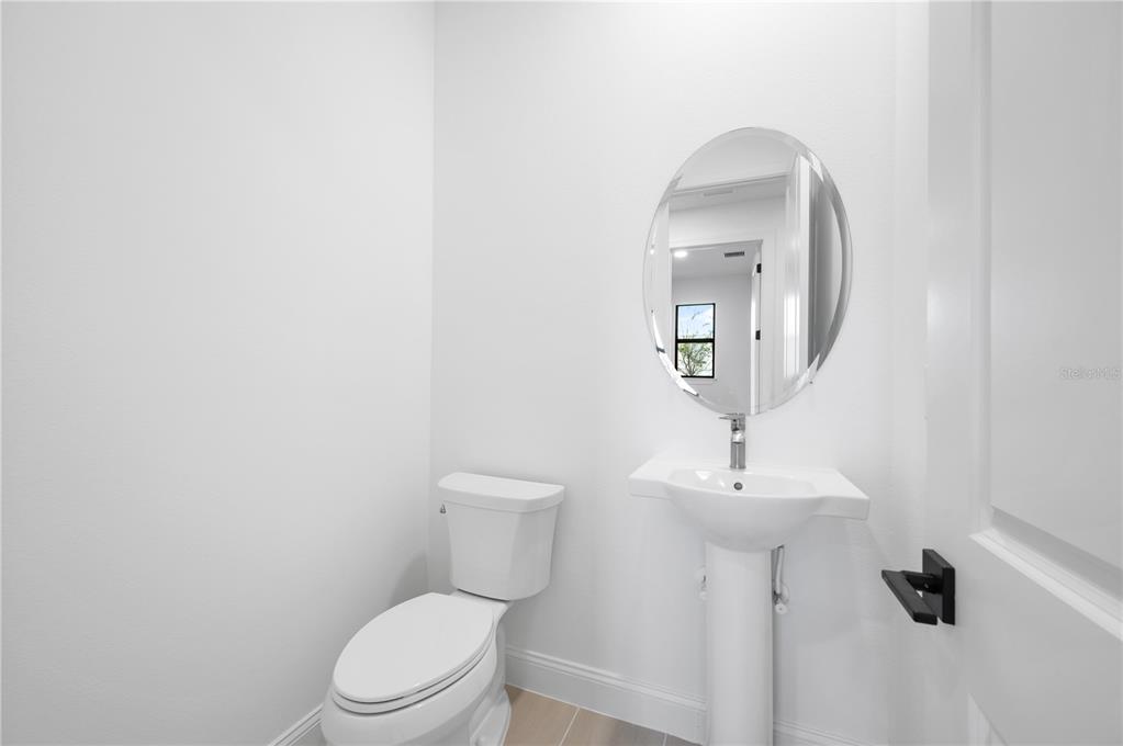 5856 Freestone Circle Apollo Beach, FL 33572 - Photo 26 of 33 a white toilet sitting next to a bathroom sink