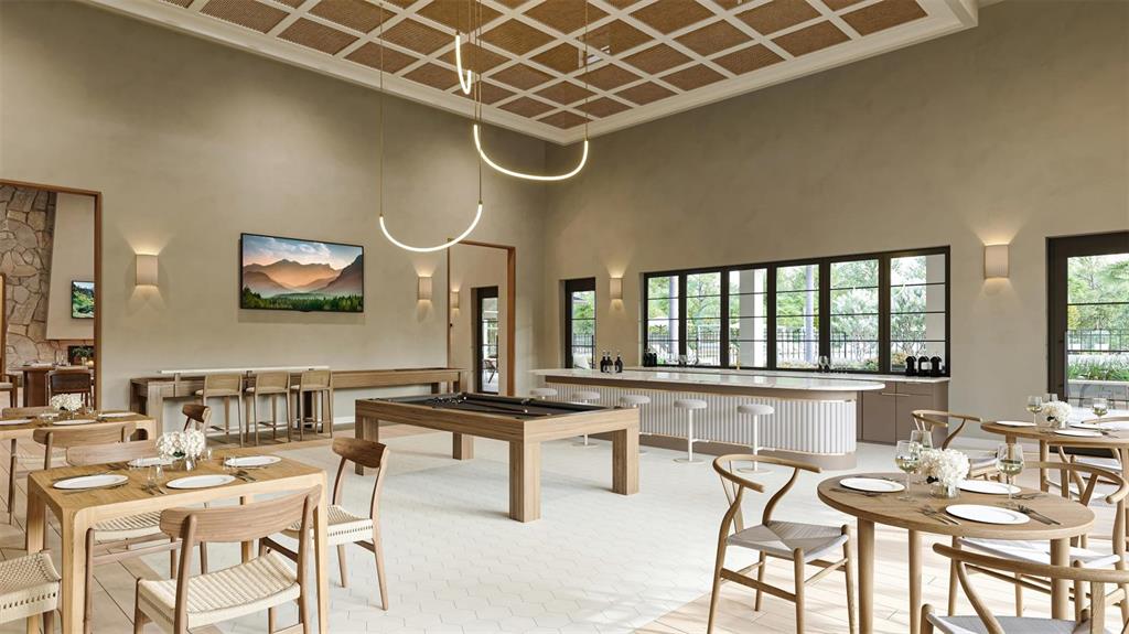 5856 Freestone Circle Apollo Beach, FL 33572 - Photo 29 of 33 a dining hall with stainless steel appliances kitchen island granite countertop furniture and a large window