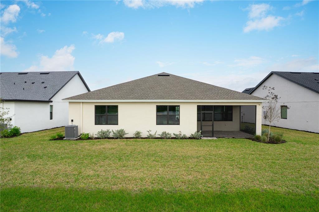 5856 Freestone Circle Apollo Beach, FL 33572 - Photo 33 of 33 a front view of house with yard and trees in the background