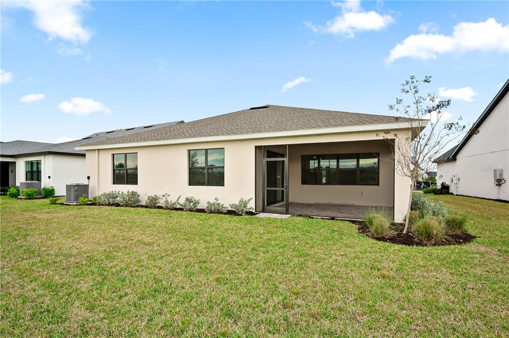 5856 Freestone Circle Apollo Beach, FL 33572 - Photo 4 of 33 a front view of a house with a garden