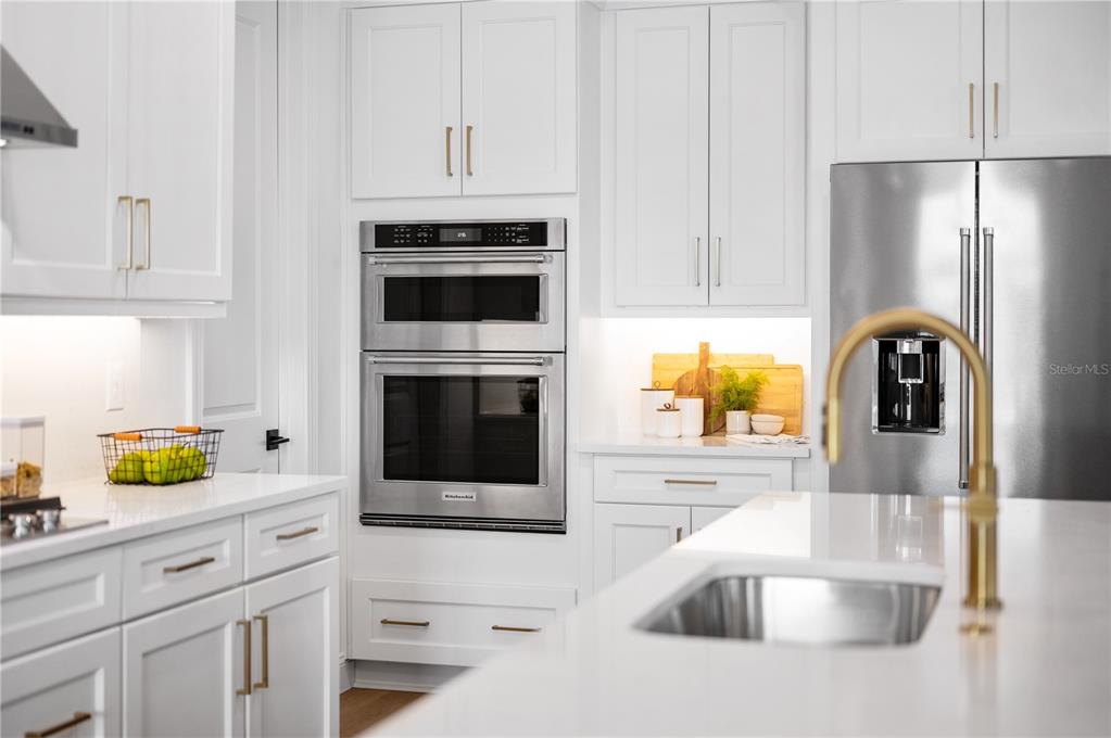 5856 Freestone Circle Apollo Beach, FL 33572 - Photo 9 of 33 a kitchen with granite countertop a sink and a stove top oven