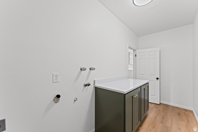 8441 Rua Branco Drive Sandy, UT 84093 - Photo 23 of 47 Modern bathroom vanity featuring a dark cabinetry base with white quartz countertop, chrome wall-mounted fixtures, and polished chrome hardware