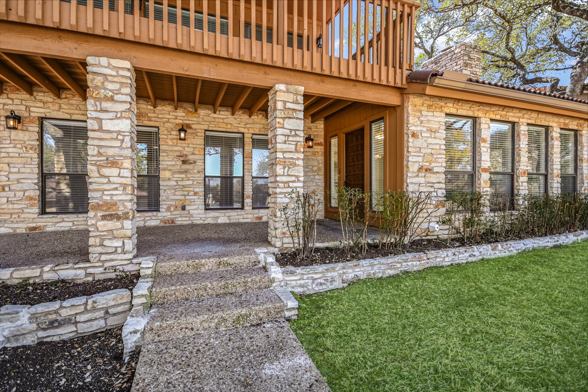 105 Crescent Bluff Austin, TX 78734 - Photo 4 of 28 a view of a house with a garden and pathway