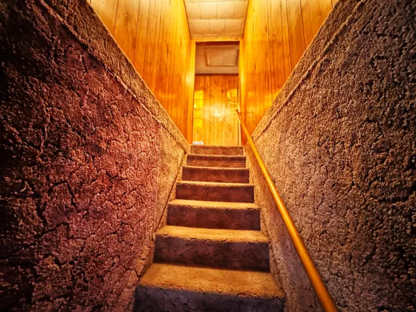 a kitchen with sink cabinets and wooden floor