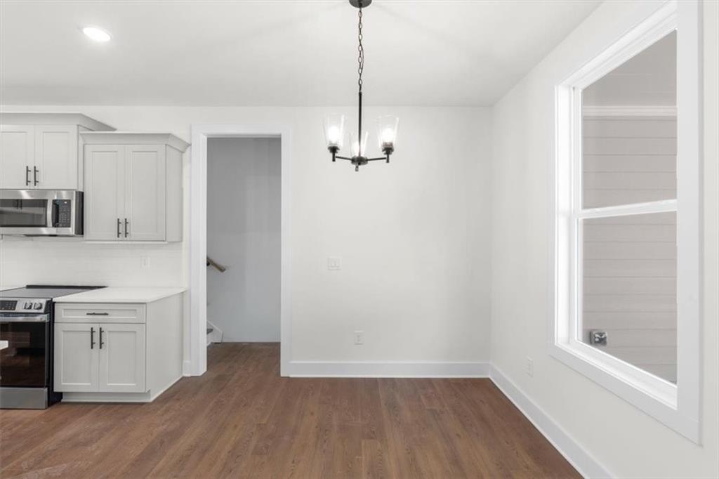 7 Everwood Court Rome, GA 30161 - Photo 21 of 55 a view of a kitchen with a sink wooden floor and a window