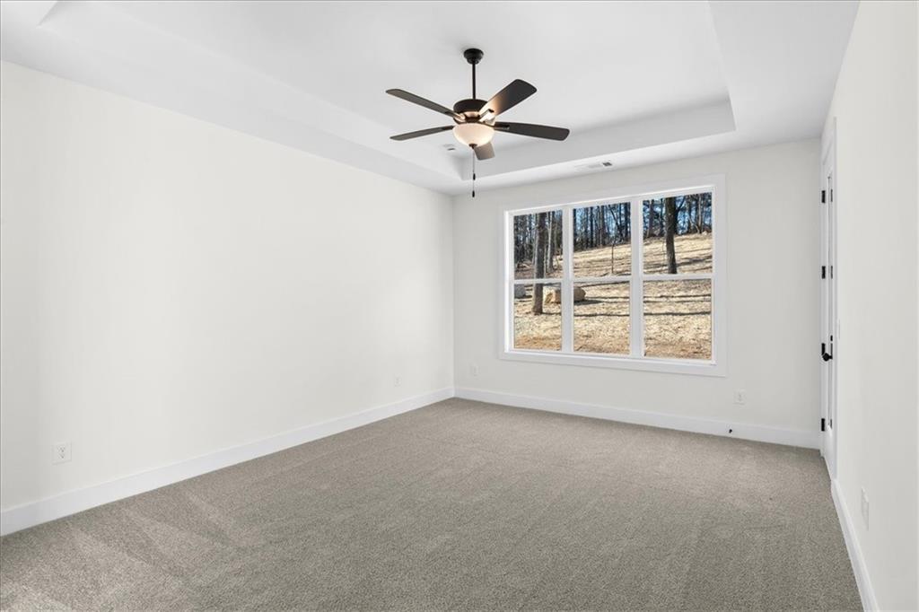 7 Everwood Court Rome, GA 30161 - Photo 24 of 55 an empty room with windows and ceiling fan
