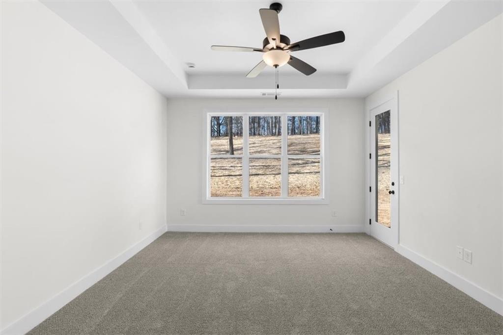 7 Everwood Court Rome, GA 30161 - Photo 26 of 55 en empty room with windows and ceiling fan