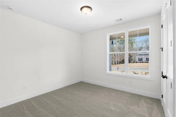 a bathroom with a granite countertop sink a toilet and bathtub
