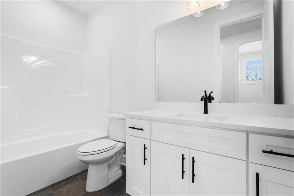 7 Everwood Court Rome, GA 30161 - Photo 33 of 55 a bathroom with a sink a toilet and shower