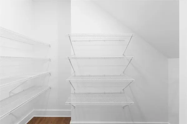 a view of a yard with snow on the road