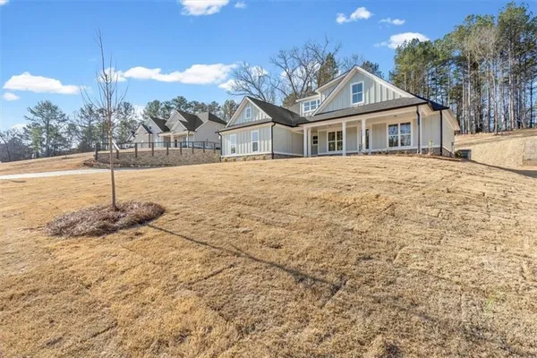 a front view of a house with a yard
