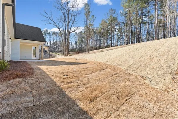 a view of a house with a snow in the background