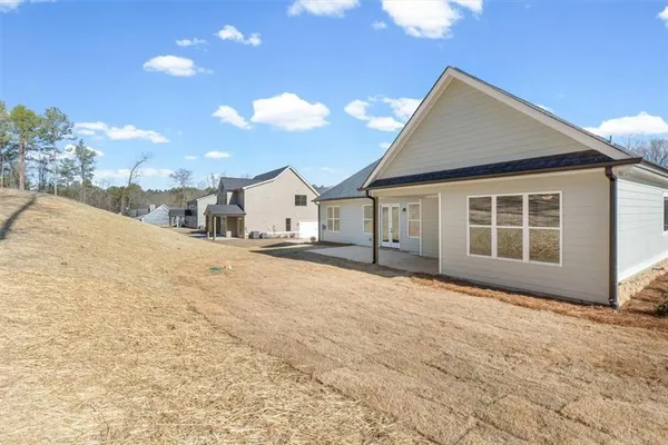 a backyard of a house with lots of trees