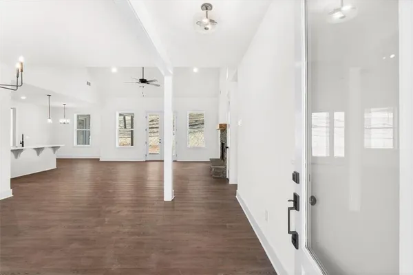 a view of an entryway with wooden floor