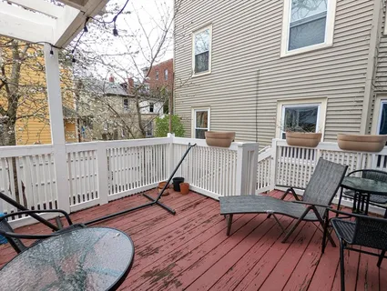 a view of a wooden chairs on deck