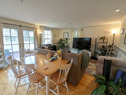 a view of a dining room with furniture window and outside view