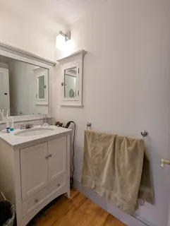 a bathroom with a sink and mirror