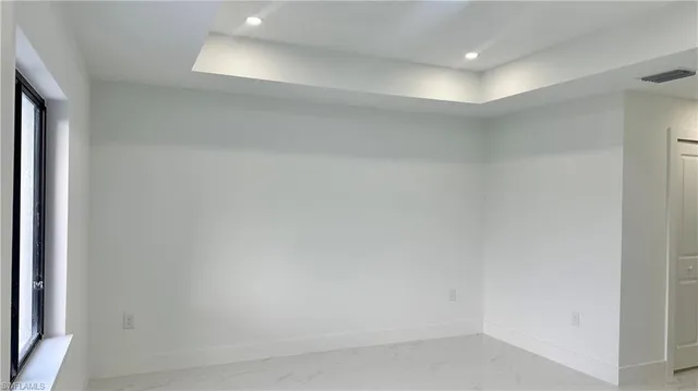 a view of a room that has a window in it