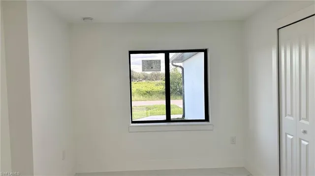 a view of a closet area with a wooden door