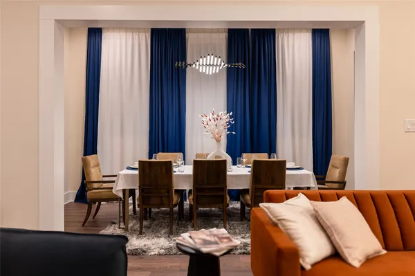 a dining room with furniture and window