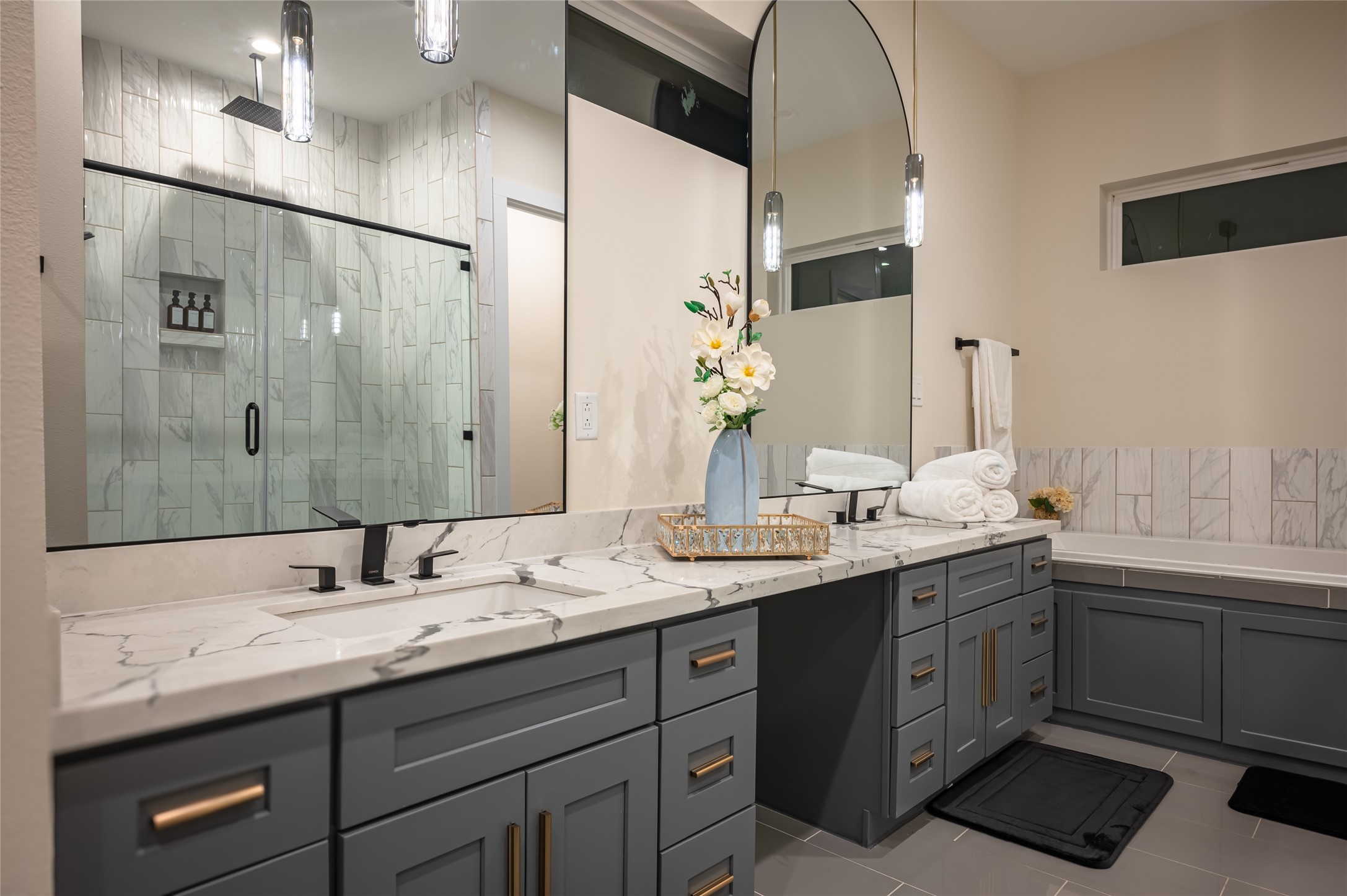915 Thompson Street Houston, TX 77007 - Photo 21 of 42 a bathroom with a double vanity sink and a mirror