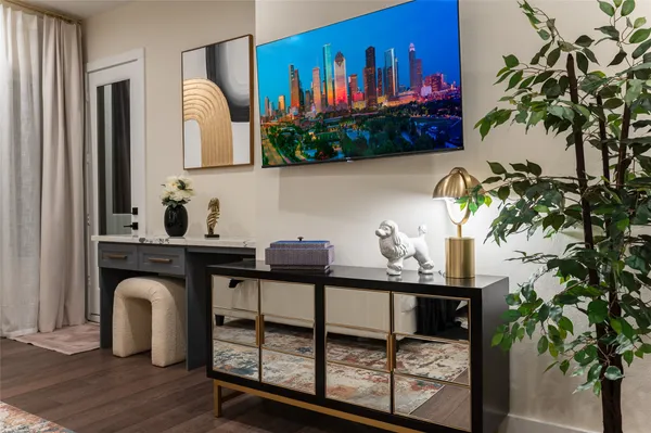 a view of entryway and hall with wooden floor
