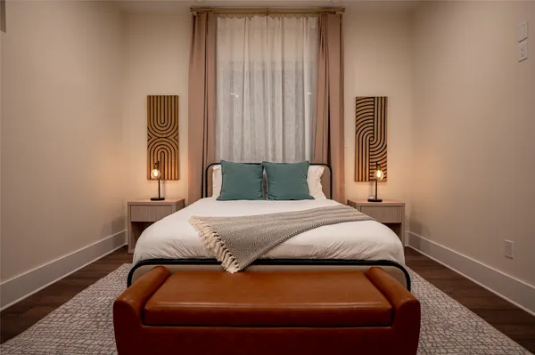 a bedroom with a bed and window