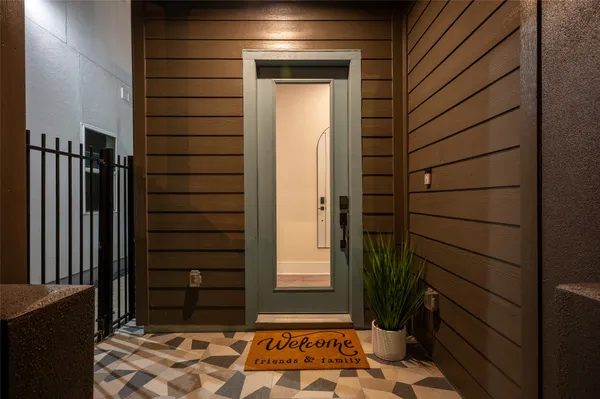 a view of a door and wooden floor