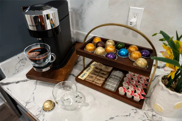 a picture of a living room with furniture and flower pot