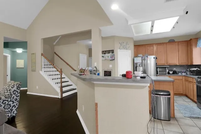 a kitchen that has a sink and a stove in it