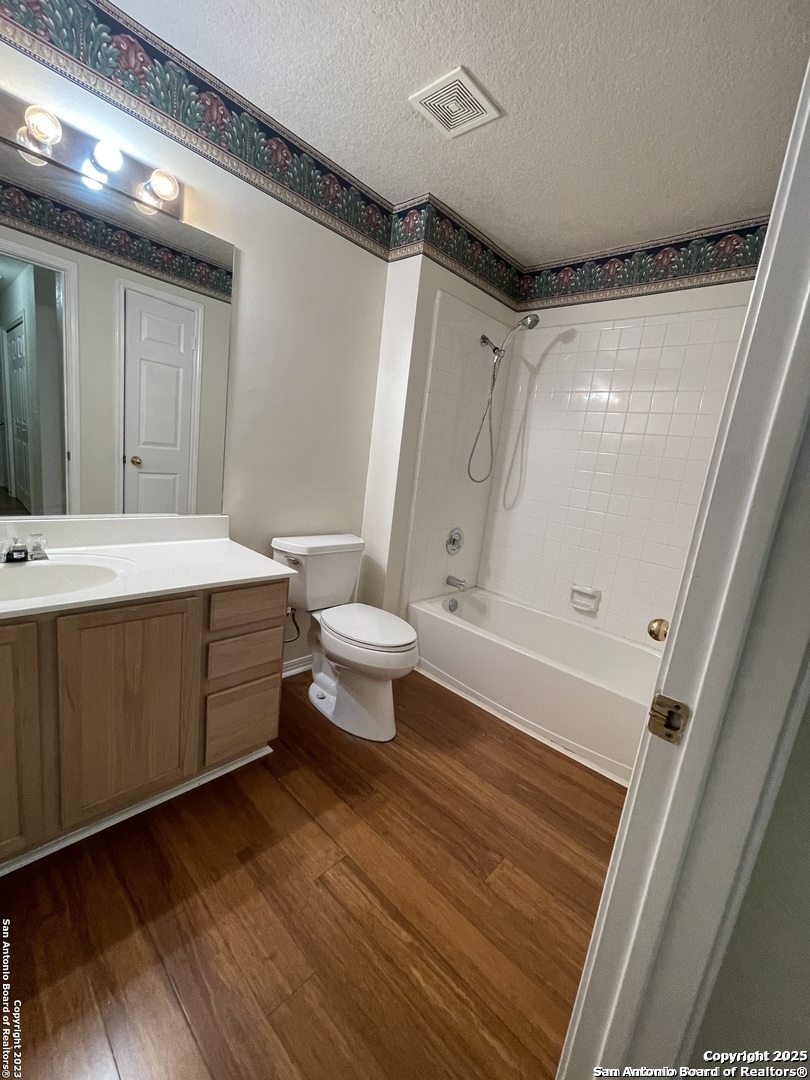 7522 Sutters Mine Converse, TX 78109 - Photo 14 of 18 a bathroom with a sink toilet and shower