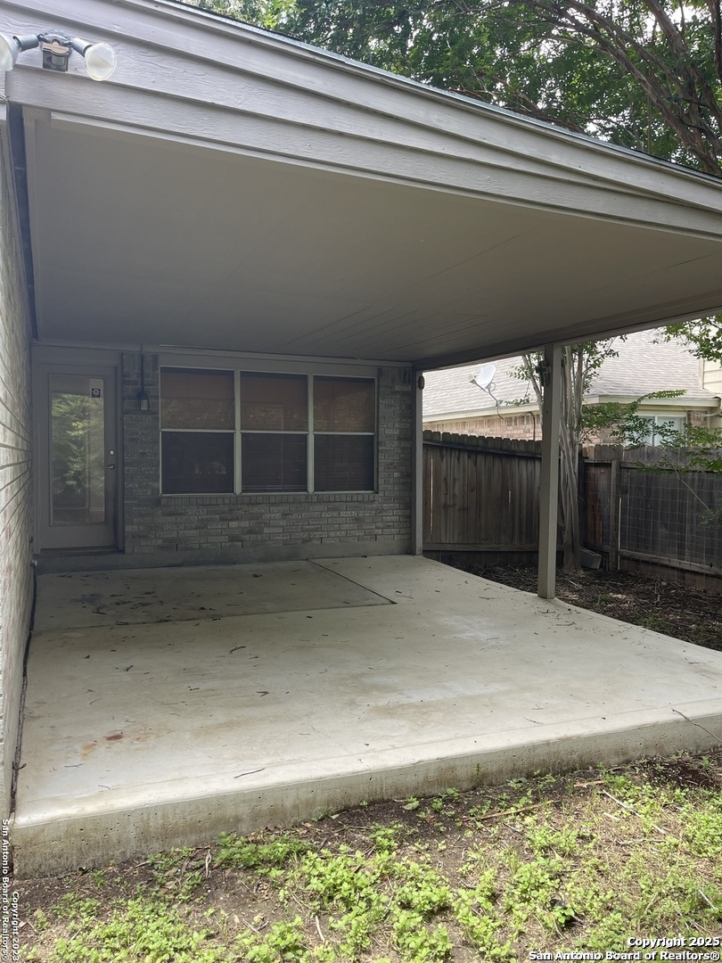 7522 Sutters Mine Converse, TX 78109 - Photo 5 of 18 a backyard of a house with a garage