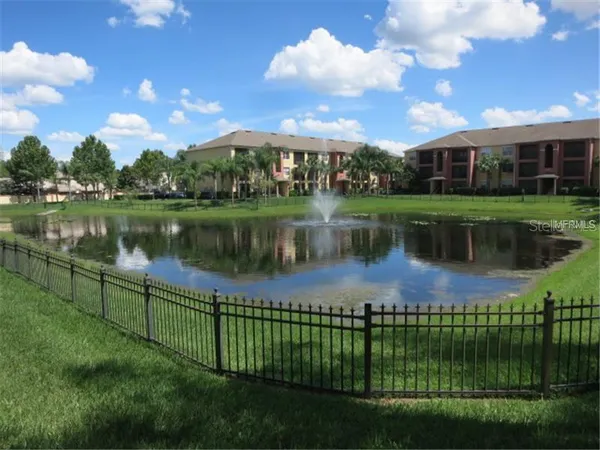 a swimming pool with outdoor seating and yard